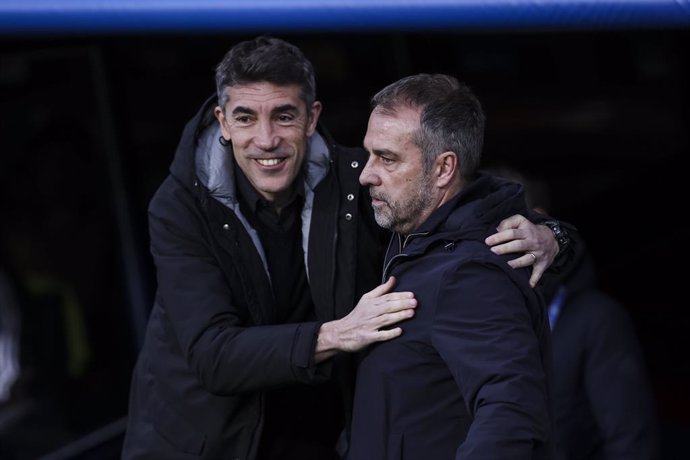 Hansi Flick, head coach of FC Barcelona greets Bruno Lage, head coach of SL Benfica during the UEFA Champions League 2024/25 Round of 16 second leg, match between FC Barcelona and SL Benfica at Estadi Olimpic Lluis Companys on March 11, 2025 in Barcelona,