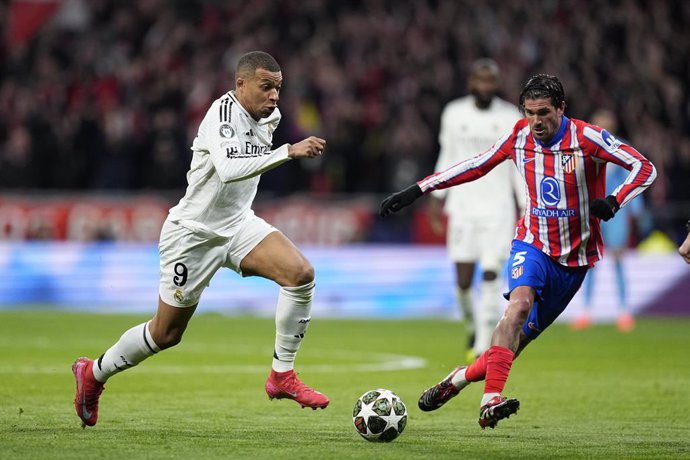 Kylian Mbappe of Real Madrid and Rodrigo de Paul of Atletico de Madrid in action during the UEFA Champions League 2024/25  League Round of 16 Second Leg match between Atletico de Madrid and Real Madrid CF, at Riyadh Air Metropolitano stadium on March 12, 