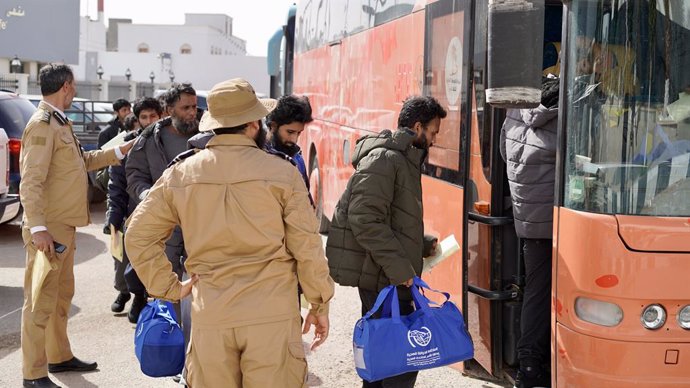 TRIPOLI, March 12, 2025  -- Migrants line up to get on a bus in Tripoli, Libya, on March 12, 2025. Libya deported 160 Bangladeshi migrants voluntarily to their home country on Wednesday, according to the Libyan Illegal Migration Control Department.