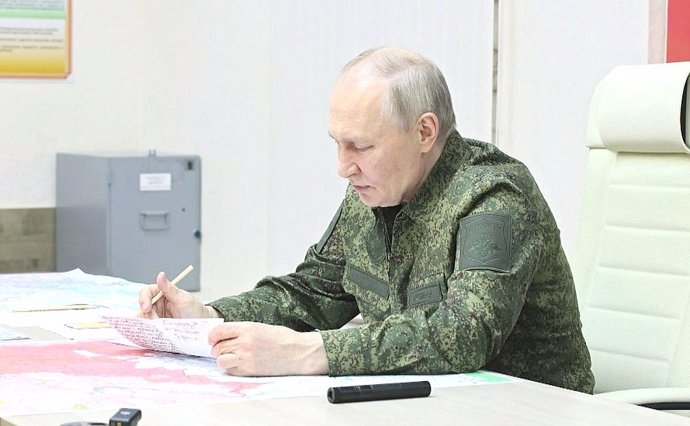 MOSCOW, March 13, 2025  -- This photo posted on the Kremlin website on March 12, 2025 shows Russian President Vladimir Putin attending a meeting at a military command center in the Kursk region. Russian President Vladimir Putin on Wednesday proposed estab