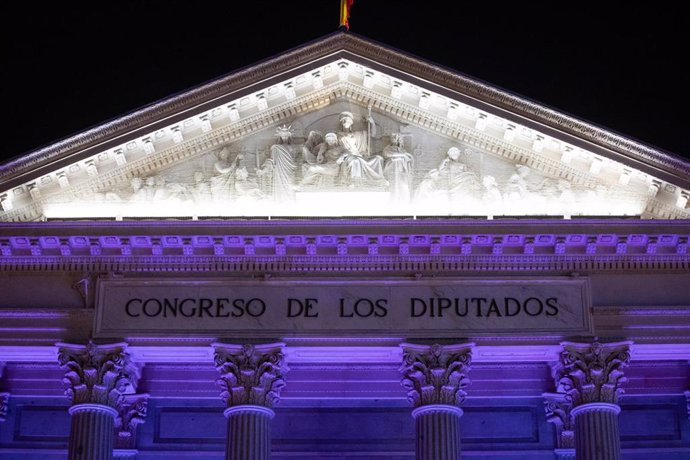 Archivo - La fachada del Congreso de los Diputados iluminada de color morado, a 25 de noviembre de 2023, en Madrid (España).