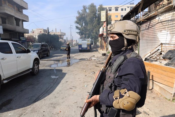 JABLEH, March 10, 2025  -- Members of the Syrian security forces stand guard on a street in the coastal city of Jableh, Latakia province, northwestern Syria, March 9, 2025. Syrian interim President Ahmed al-Sharaa on Sunday announced the formation of a Hi