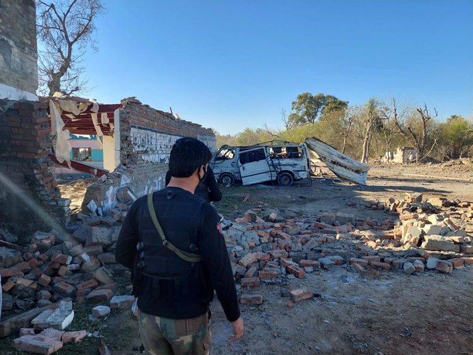 BANNU, March 5, 2025  -- A security official examines the attack site in the Bannu district of northwest Pakistan's Khyber Pakhtunkhwa province on March 5, 2025. Twelve civilians and six terrorists were killed and 32 people injured when terrorists targete