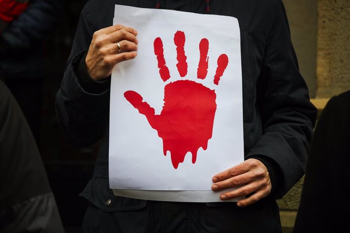 Archivo - February 1, 2025, Cracow, Poland: Bloody red hand is seen on a placard during protest. Serbian students of the Jagiellonian University demonstrated in solidarity with their colleagues from their homeland, who started protests against corruption 