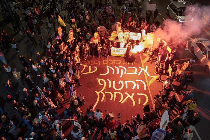 March 11, 2025, Tel Aviv, Israel: The protesters lit a bonfire and some held flares as they wrote in large letters on the road that they would fight until the last of the hostage will  returned to Israel. Demonstrations for the release of the hostages fro