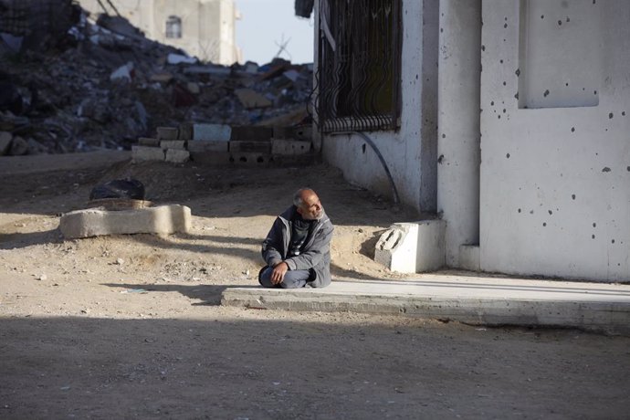 March 14, 2025, Nuseirat, Gaza Strip, Palestinian Territory: A scene of devastation as Palestinians continue their daily lives with limited resources amid the rubble of buildings destroyed by Israeli attacks on the Nuseirat refugee camp in central Gaza St