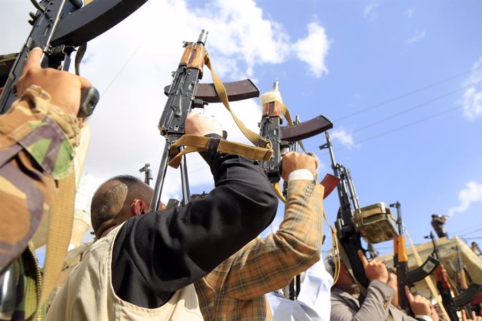 SANAA, March 12, 2025  -- Armed men loyal to the Houthi group participate in an armed tribal rally supporting the resumption of attacks against Israeli ships, in Sanaa, Yemen, on March 11, 2025.   Yemen's Houthi group announced Tuesday night the resumptio