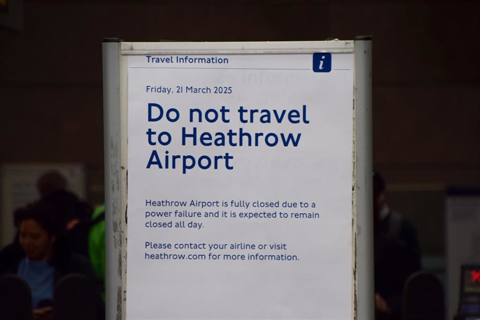 A sign at a London Underground station warns people not to travel to Heathrow Airport after a fire broke out at the North Hyde Electricity Substation in Hayes, causing the nearby Heathrow Airport to close with thousands of flights affected.