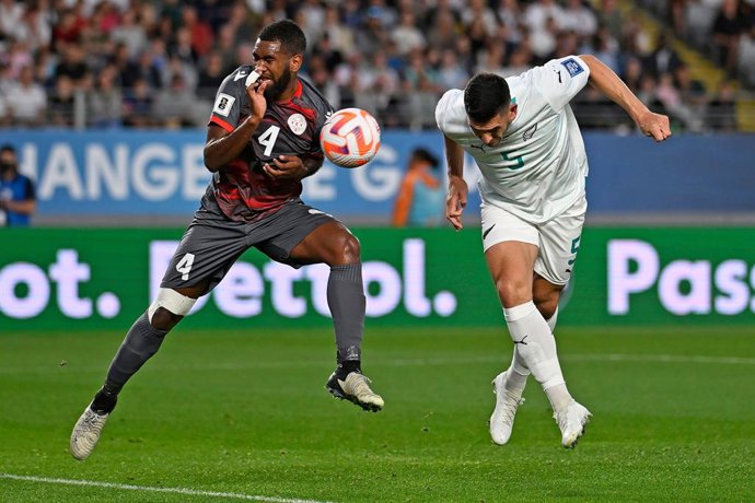 24 March 2025, New Zealand, Auckland: New Caledonia's Pierre Bako and New Zealand's Michael Boxall in action during the FIFA World Cup 2026 Oceania Qualifier match between New Zealand and New Caledonia at Eden Park in Auckland. Photo: Andrew Cornaga/AAP/d