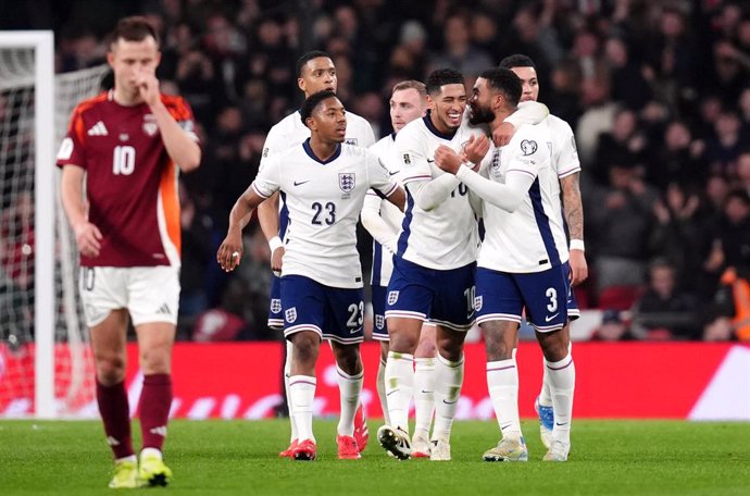24 March 2025, United Kingdom, London: England's Reece James (R) celebrates with team-mate Jude Bellingham after scoring their side's first goal of the game from a free-kick during the 2026 FIFA World Cup European qualifiers Group K soccer match between E