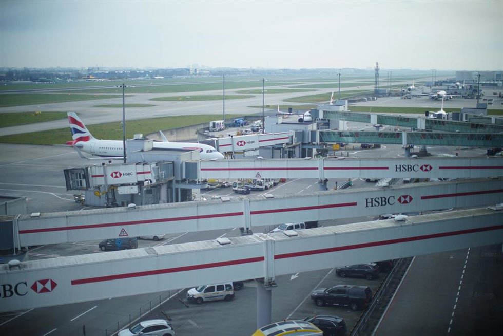 21 March 2025, United Kingdom, London: Parked planes and an empty runway at Heathrow Terminal 5 in London. 