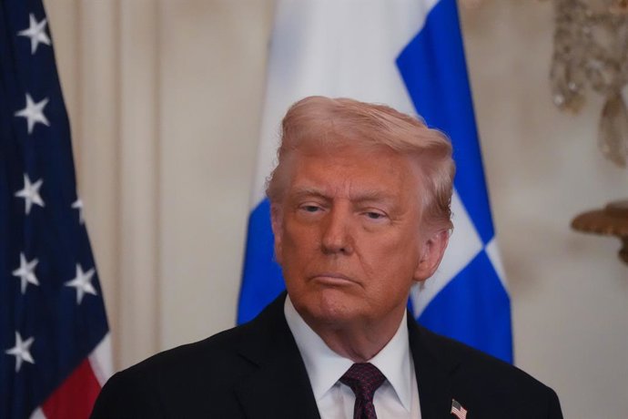 24 March 2025, US, Washington: US President Donald Trump celebrates Greek Independence Day with Greek Orthodox Archbishop Elpidophoros of America at the White House, where the Archbishop presents him with a golden cross. Photo: Andrew Leyden/ZUMA Press Wi