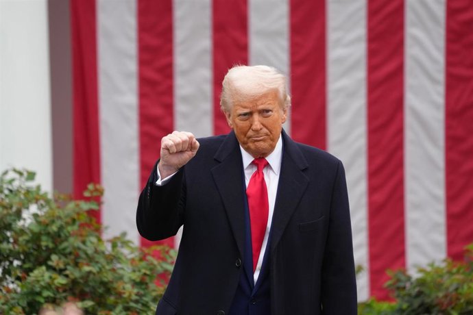 April 2, 2025, Washington, District of Columbia, USA: President DONALD TRUMP raises a fist during a ceremony where he signs two executive orders that will lead to reciprocal tariffs against other countries that charge tariffs on US goods. The signing cere