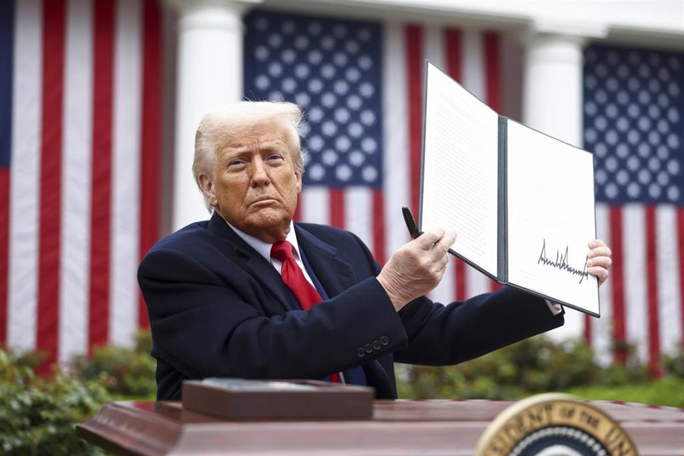 April 2, 2025, Washington, District Of Columbia, USA: US President DONALD TRUMP holds up a signed executive order implementing new reciprocal tariffs against US trading partners in the Rose Garden of the White House in Washington. Trump has branded the 
