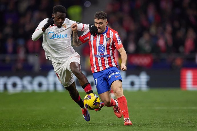 Archivo - Javi Galan (Atletico de Madrid) and Agoume (Sevilla FC) during the Spanish League, LaLiga EA Sports, football match played between Atletico de Madrid and Sevilla FC at Riyadh Air Metropolitano stadium on December 08, 2024 in Madrid, Spain.