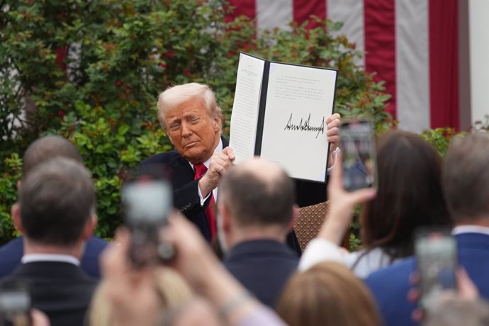 President Donald J Trump displays the signed Executive Order after concluding his remarks during a 'Make America Wealthy Again' event in the Rose Garden of the White House in Washington, DC on Wednesday, April 2, 2025. 