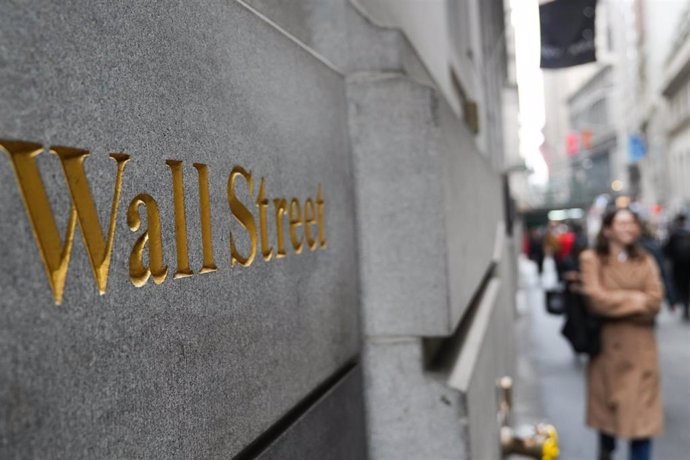 April 3, 2025, New York, New York, USA: A pedestrian walks along Wall Street as the stock market falls on Wall Street as Trump's sweeping tariffs rattle global markets.