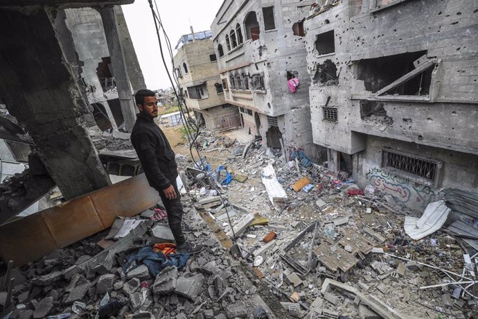 GAZA, March 20, 2025  -- A Palestinian man stands in a destroyed building after an Israeli airstrike in the northern Gaza Strip town of Beit Lahia, on March 20, 2025. The Israeli military said on Thursday its forces had begun ground operations in northern