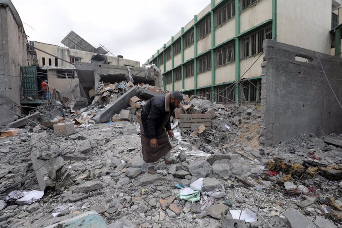 April 13, 2025, Dair El-Balah, Gaza Strip, Palestinian Territory: Palestinians inspect the damage to the Deir al-Balah municipality building after an Israeli airstrike killed three people and injured others, Deir al-Balah, central Gaza Strip, on13 April 2