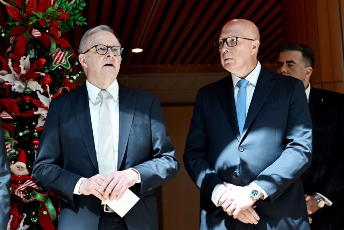 Recent polls suggest that the upheaval caused by U.S. President Donald Trump is damaging centre-right political parties in Australia, which could spell defeat for conservative Opposition Leader Peter Dutton (right) (Photo by Tracey Nearmy/AFP)