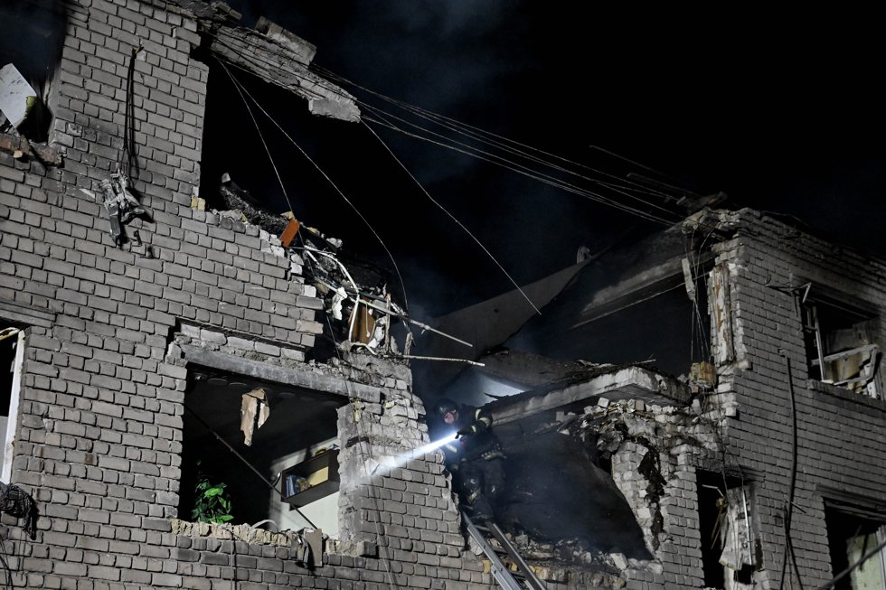 01 May 2025, Ukraine, Zaporizhzhia: A firefighter puts out a fire in an apartment block damaged by a large-scale Russian drone attack in Zaporizhzhia. Photo: Dmytro Smolienko/Ukrinform/dpa