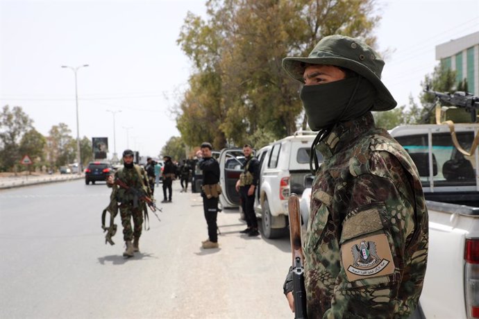 ASHRAFIYAT SAHNAYA (SYRIA), April 30, 2025  -- Syrian security forces are seen in the town of Ashrafiyat Sahnaya, southwest of Damascus, Syria, on April 30, 2025. The death toll from ongoing sectarian clashes in the southern suburbs of Damascus climbed to
