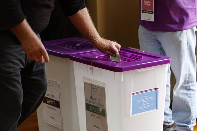 April 22, 2025, Melbourne, Victoria State, Australia: A person places their ballot into a box at a polling centre during early voting for the 2025 Australian federal election. Werribee Masonic Hall serves as an early voting centre in the Division of Lalor