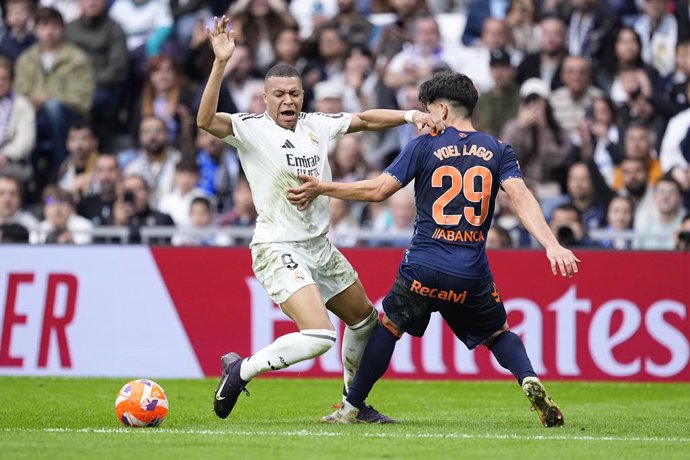 Kylian Mbappe of Real Madrid and Yoel Lago of Celta de Vigo in action during the Spanish League, LaLiga EA Sports, football match played between Real Madrid and RC Celta de Vigo at Santiago Bernabeu stadium on May 04, 2025 in Madrid, Spain.