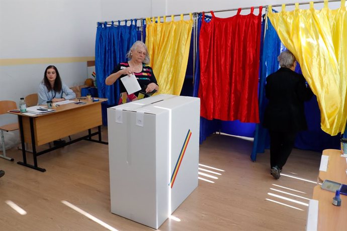 BUCHAREST, May 4, 2025  -- A woman votes during the first round of the presidential election rerun at a polling station in Bucharest, Romania, May 4, 2025. Romanians headed to the polls on Sunday for the first round of the presidential election rerun cont