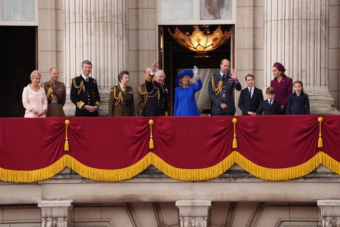 05 May 2025, United Kingdom, London: UK king Charles III and Queen Camilla, stand with members of the British Royal Family on the balcony of Buckingham Palace, as they view the fly past featuring the Royal Air Force's Red Arrows and current and historic m