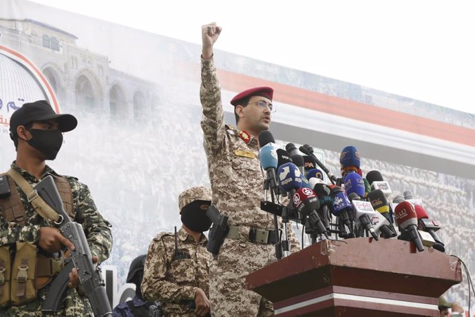 SANAA, April 19, 2025  -- Houthi military spokesperson Yahya Sarea delivers a statement in front of a protest against U.S. airstrikes on Yemeni fuel port of Ras Isa and in solidarity with Palestinians, in Sanaa, Yemen, April 18, 2025.