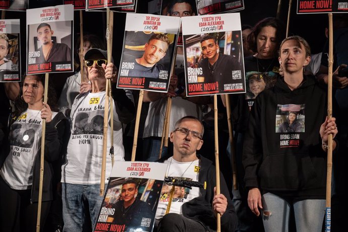 May 3, 2025, Tel Aviv, Israel: Parents of the hostages on stage in the hostage Square hold placards with portraits of their children who are still in Hamas captivity, in a wheelchair is a father of the Israeli-American hostage, Idan Alexander. People demo