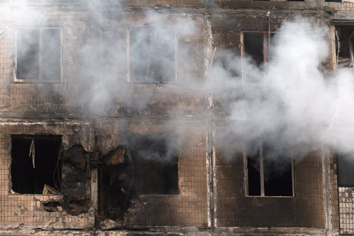 07 May 2025, Ukraine, Kiev: Smoke rises from a fire-stricken apartment block damamged by the falling Russian drone. Photo: -/Ukrinform/dpa