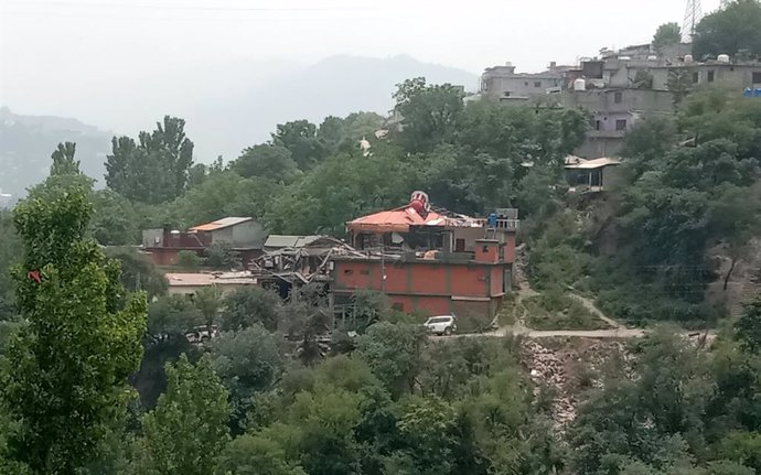 MUZAFFARABAD, May 7, 2025  -- This photo taken with mobile phone on May 7, 2025 shows a damaged building following an Indian missile attack in Muzaffarabad, Pakistan-controlled Kashmir. Twenty-six people, including women and children, were killed and 46 o