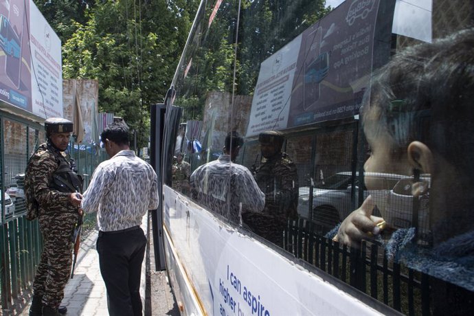May 10, 2025, Srinagar, Kashmir, India: An Indian armed personnel checks the identity card of a passenger preparing to leave Kashmir following loud explosions heard in Srinagar. The blasts were reported across Jammu and Kashmir earlier in the day, with de