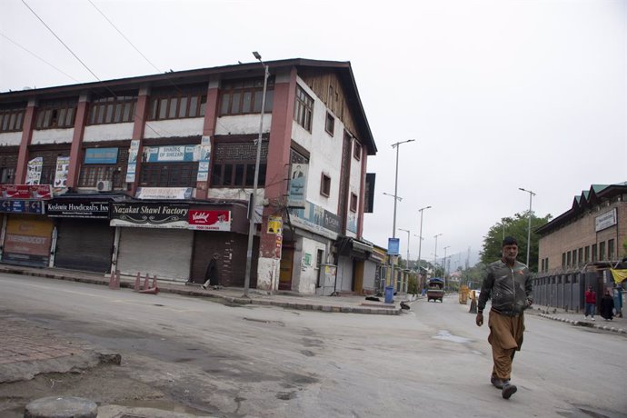 May 10, 2025, Srinagar, Kashmir, India: A man walks through the city center after loud explosions were heard in Srinagar. The scene follows multiple blasts reported across Jammu and Kashmir earlier in the day, with debris of a projectile-like object recov