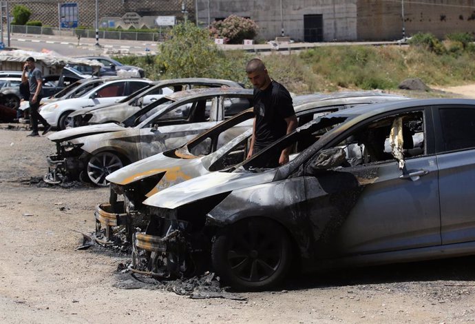 SALFIT, May 17, 2025  -- A Palestinian checks cars burned by Israeli settlers near the West Bank city of Salfit, May 16, 2025.