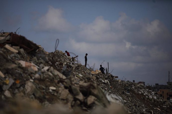 May 5, 2025, Bureij, Gaza Strip, Palestinian Territory: A view of the destruction as Palestinians continue their daily life with limited resources among the rubble of buildings destroyed as a result of Israeli attacks in Al_ Bureij refuge camp,central Gaz
