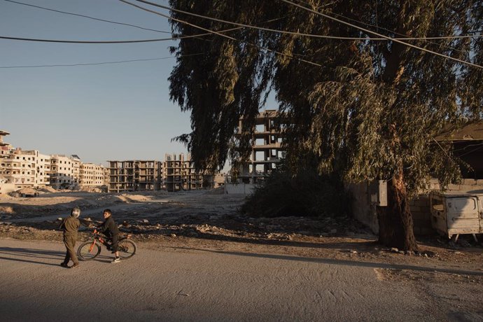May 20, 2025, Damascus, Syria: DAMASCUS, SYRIA - APRIL 15: Boys cycle in the suburb of Jobar, which was destroyed during the war, on April 15, 2025 in Jobar, Damascus, Syria...Jobar, a suburb of the Syrian capital Damascus, was for years a strategic front