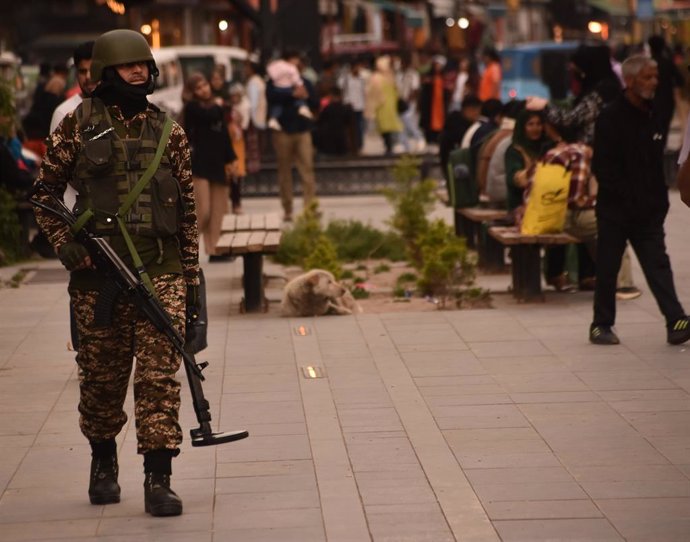 May 3, 2025, Srinagar, Jammu And Kashmir, India: Indian paramilitary soldiers patrol along a street. The government of Pakistan-administered Kashmir has started stockpiling two months' worth of additional food supplies for populations residing near the Li