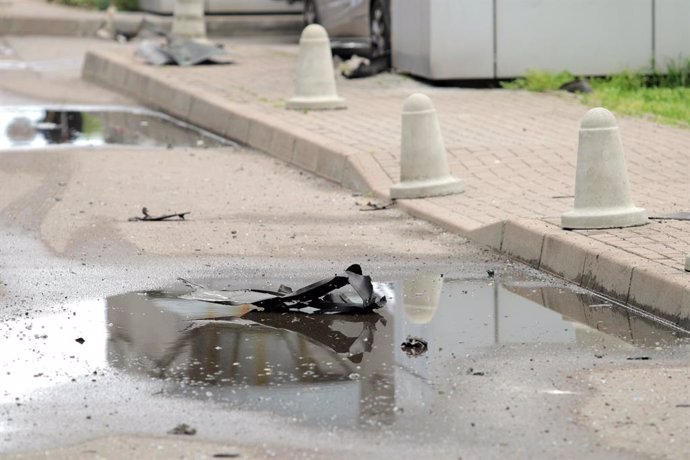 May 7, 2025, Kyiv, Ukraine: Fragments of a downed drone are seen outside the apartment block damaged during a Russian attack on the territory of a residential complex in the Dniprovskyi district of Kyiv, Ukraine, on May 7, 2025