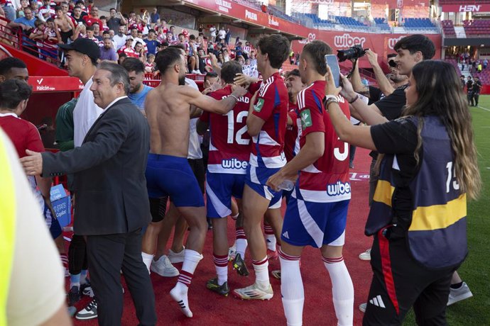 Granada CF players celebrates the final result of Racing de Santander Match during the Spanish league, LaLiga Hypermotion, football match played between Granada CF and CD Castellon, at Nuevo Los Carmenes stadium on May 25, 2025, in Granada, Spain.