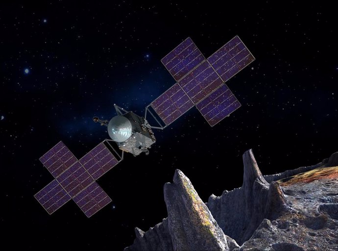 Archivo - Esta ilustración muestra la nave espacial de la misión Psyche de la NASA cerca del objetivo de la misión, el asteroide Psyche, rico en metales.