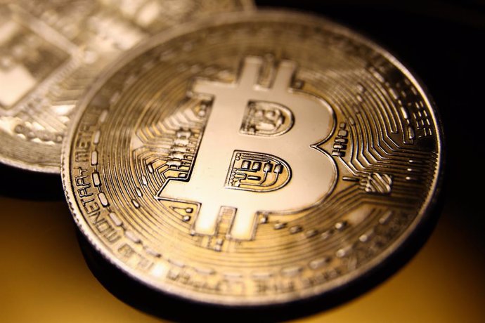 Archivo - May 4, 2023, Krakow, Poland: Bitcoin cryptocurrency physical representation is photographed for illustration photo in Krakow, Poland on May 4, 2023.