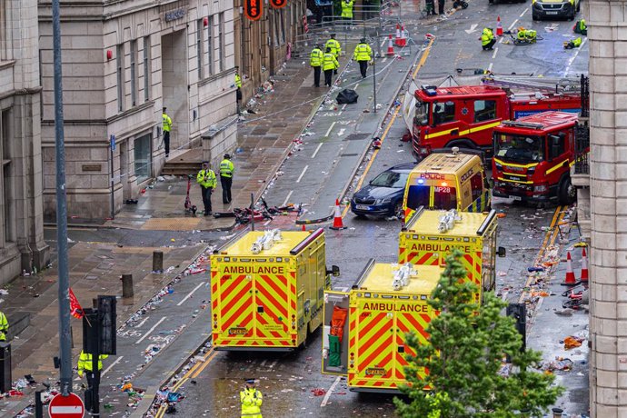 LIVERPOOL, May 27, 2025  -- Police officers and emergency workers are pictured on the scene of an incident in which a car ploughed into a crowd celebrating Liverpool Football Club's Premier League victory in Liverpool, Britain, May 26, 2025. Dozens of peo