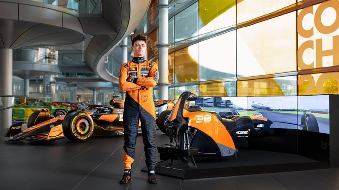 McLaren Formula 1 Team Driver Lando Norris with the McLaren Racing Motion Simulator by Racing Unleashed and the McLaren F1 Team race car at the McLaren Technology Center (MTC) in Woking, UK.