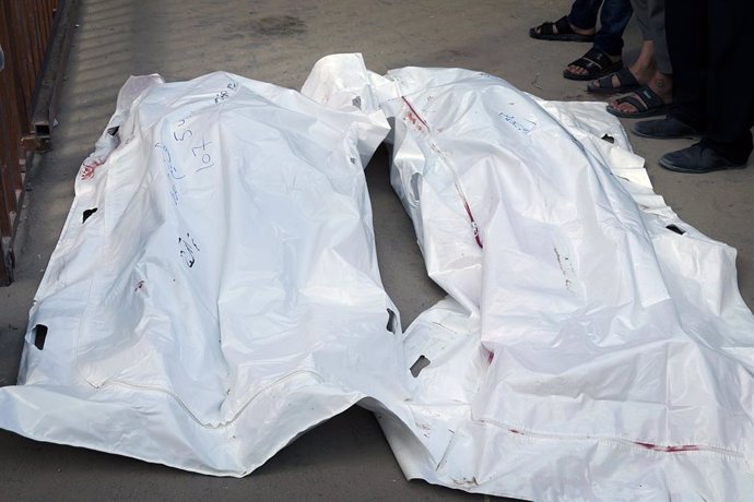 June 3, 2025, Gaza City, Gaza Strip, Palestinian Territory: Palestinians mourn by the bodies of relatives who were killed by Israeli fire as they gathered near a US-backed aid center, at the Nasser hospital in the southern Gaza Strip on June 3, 2025. Resc