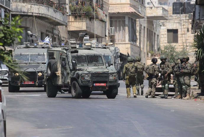 June 10, 2025, Nablus, West Bank, Palestinian Territory: Israeli soldiers take aim during a raid in the old town of Nablus city in the occupied West Bank on June 10, 2025. Israel has occupied the West Bank since 1967, and violence there has soared since t