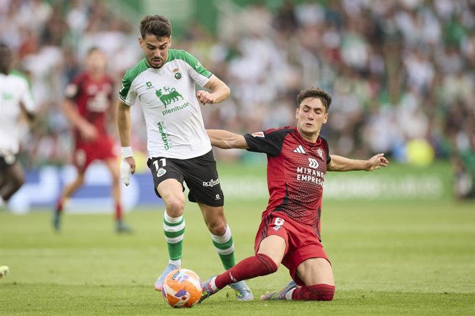 Andres Martin of Real Racing Club de Santander competes for the ball with Jon Gorrotxategi of CD Mirandes during the LaLiga Hypermotion match between Racing Santander and CD Mirandes at Campos de Sport de El Sardinero on June 8, 2025, in Santander, Spain.