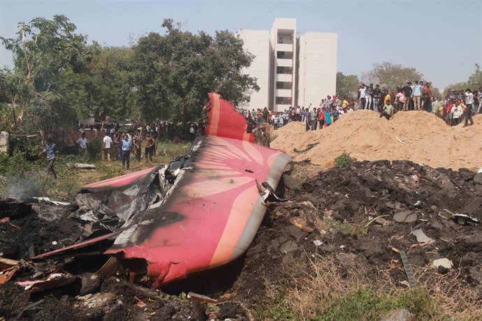 AHMADABAD, June 12, 2025  -- People look at the debris of an Air India plane crashed in Ahmedabad of India's Gujarat state, June 12, 2025.   